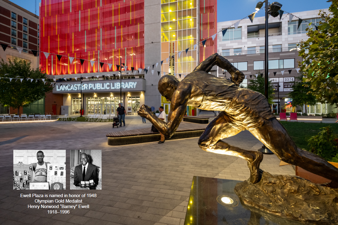 The plaza features public art honoring local Olympian Barney Ewell, with his statue integrated into the design. This strategic placement enhances space activation, celebrates its historical significance, and adds an interactive element to the plaza.